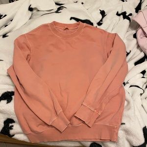 brandy melville salmon coloured crewneck